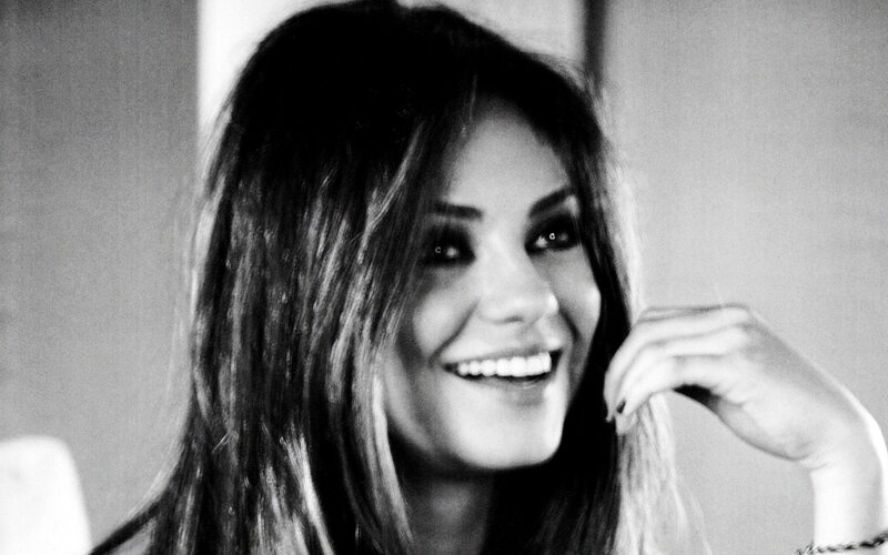 woman smiling in black and white