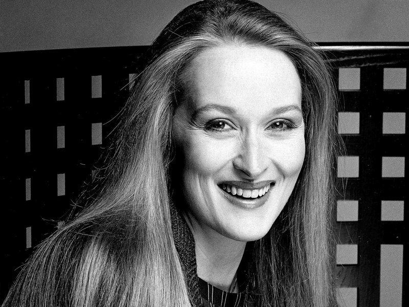 woman smiling in black and white