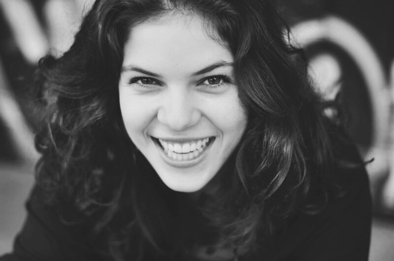 woman smiling in black and white
