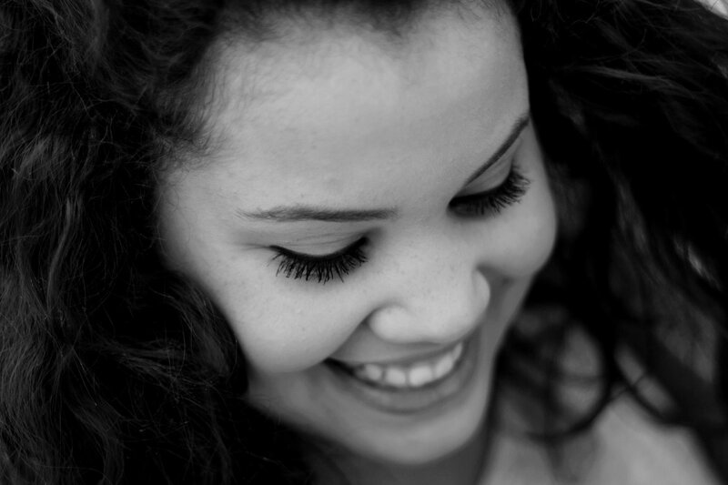 woman smiling in black and white