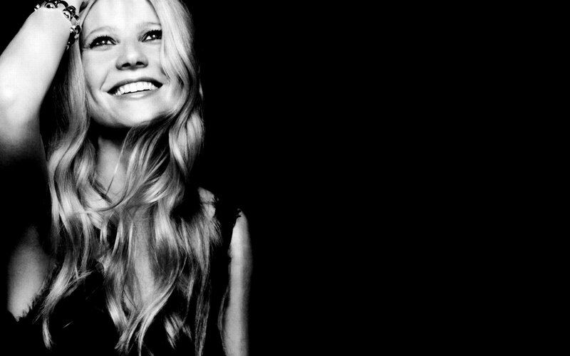 woman smiling in black and white