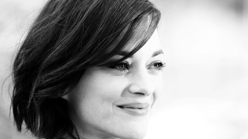 woman smiling in black and white