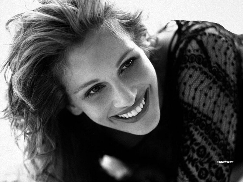 woman smiling in black and white