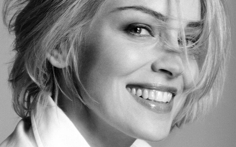 woman smiling in black and white