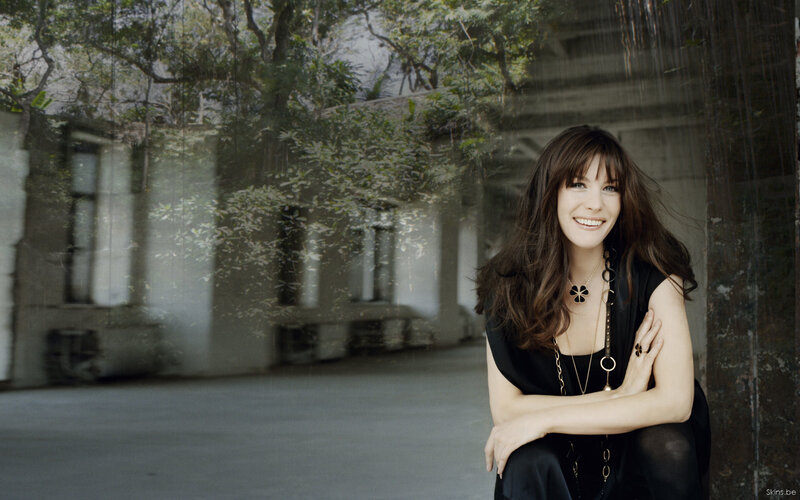 Woman smiling in black dress