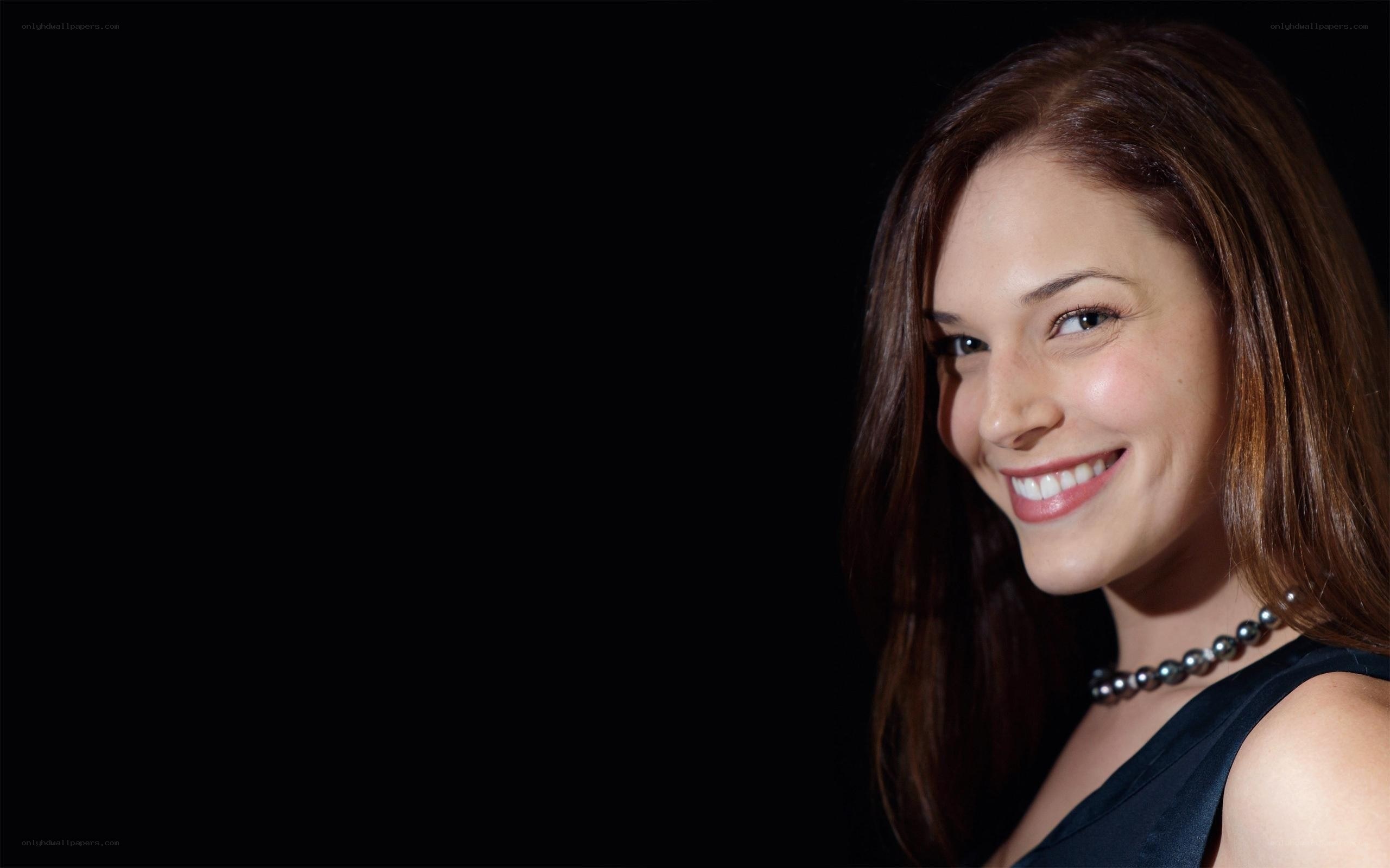 woman smiling in black dress