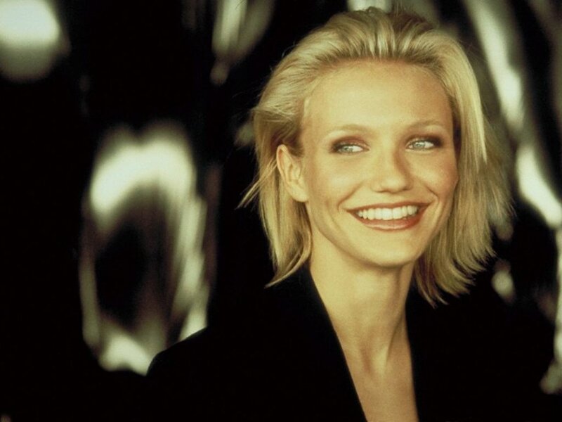 woman smiling in black jacket