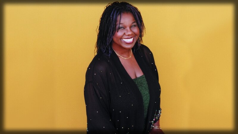 woman smiling in black jacket