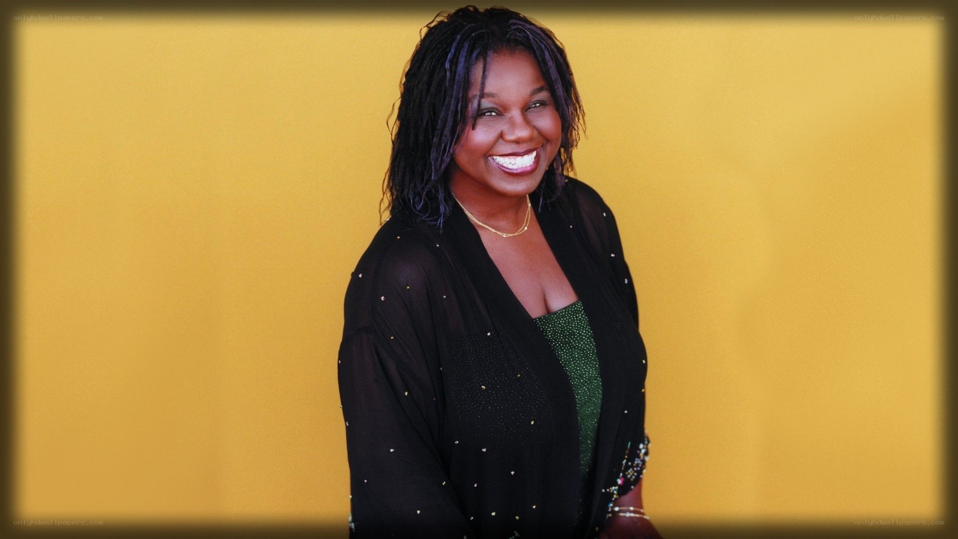 woman smiling in black jacket