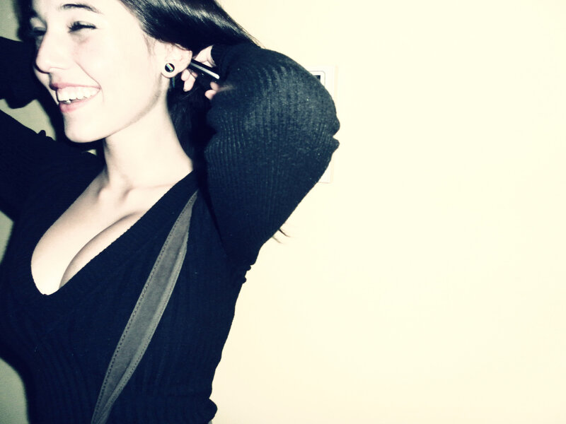 woman smiling in black sweater
