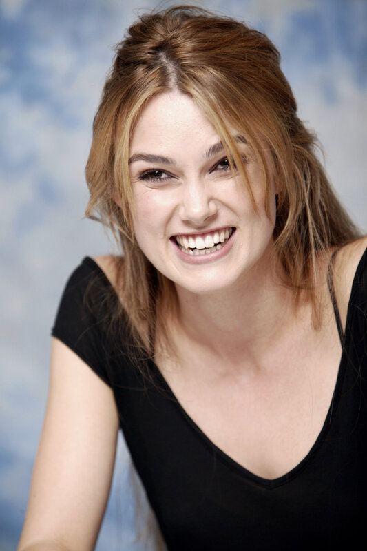 woman smiling in black top