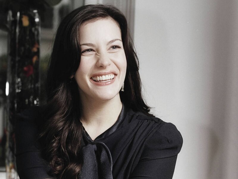 woman smiling in black top