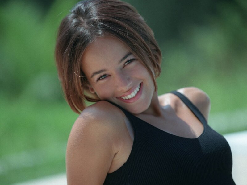 woman smiling in black top