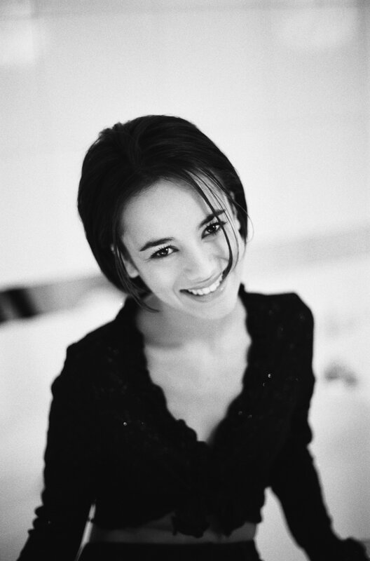 woman smiling in black top