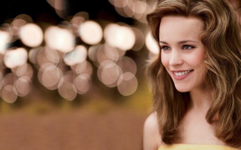 woman smiling in bokeh lights
