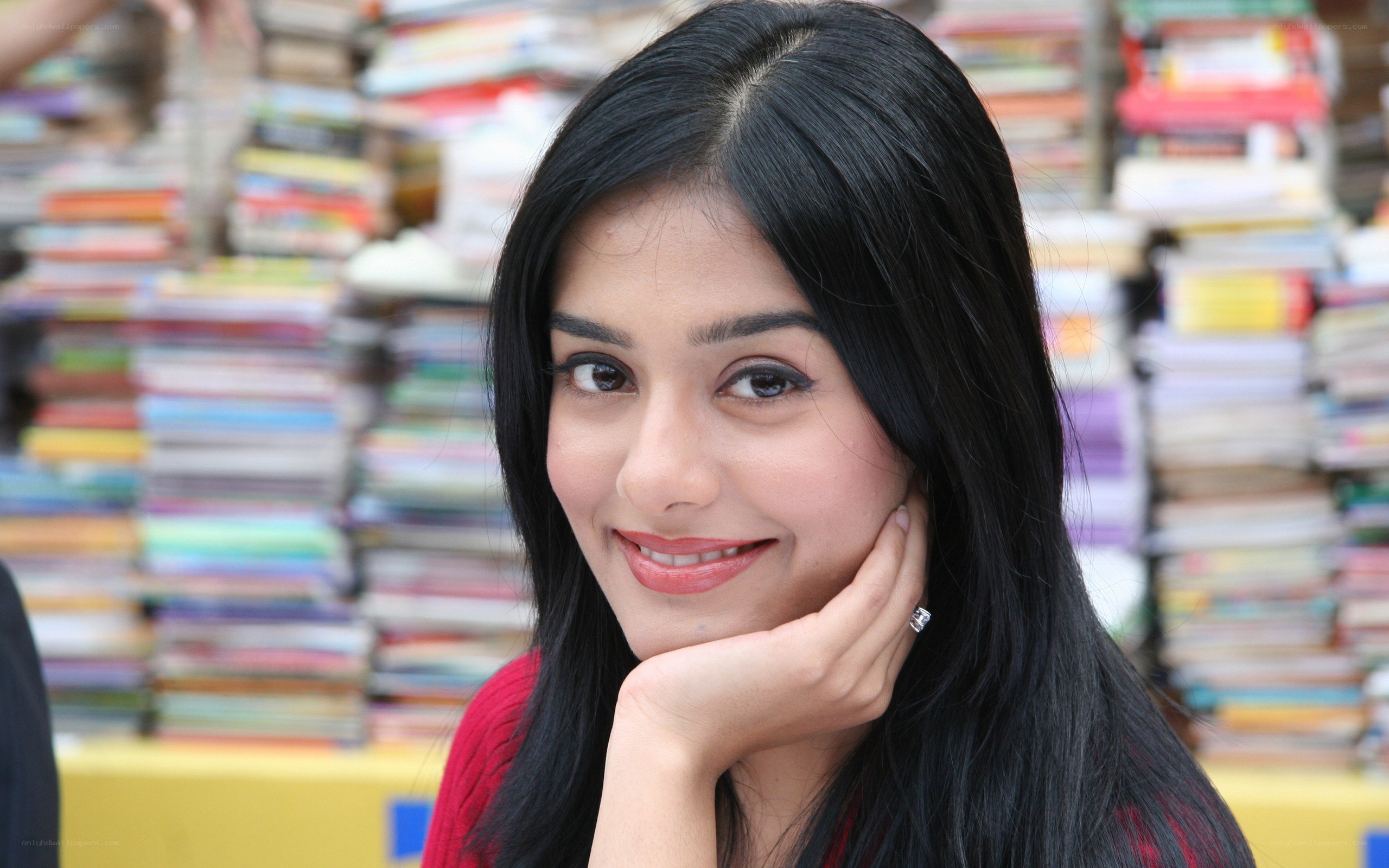 woman smiling in bookstore