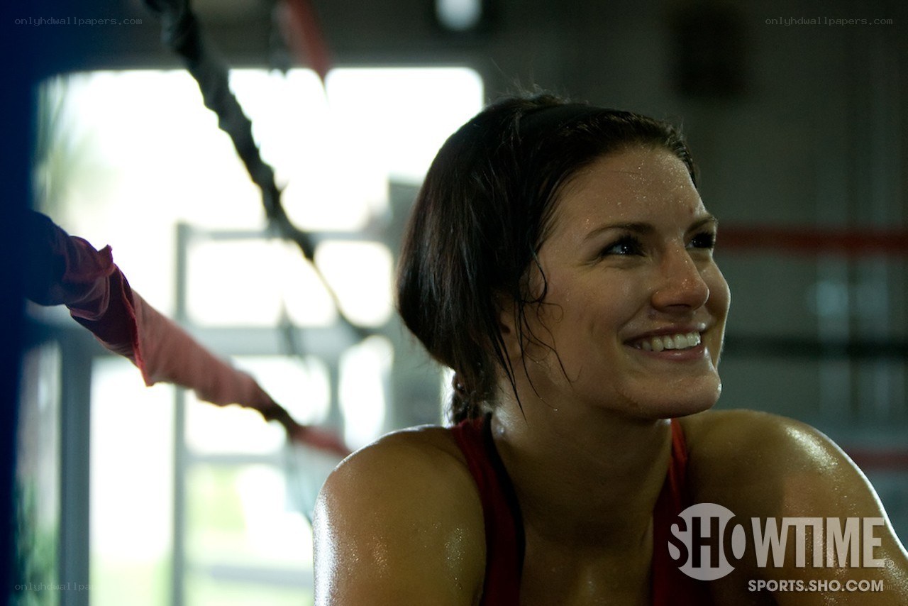woman smiling in boxing ring