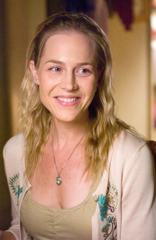 woman smiling in cardigan