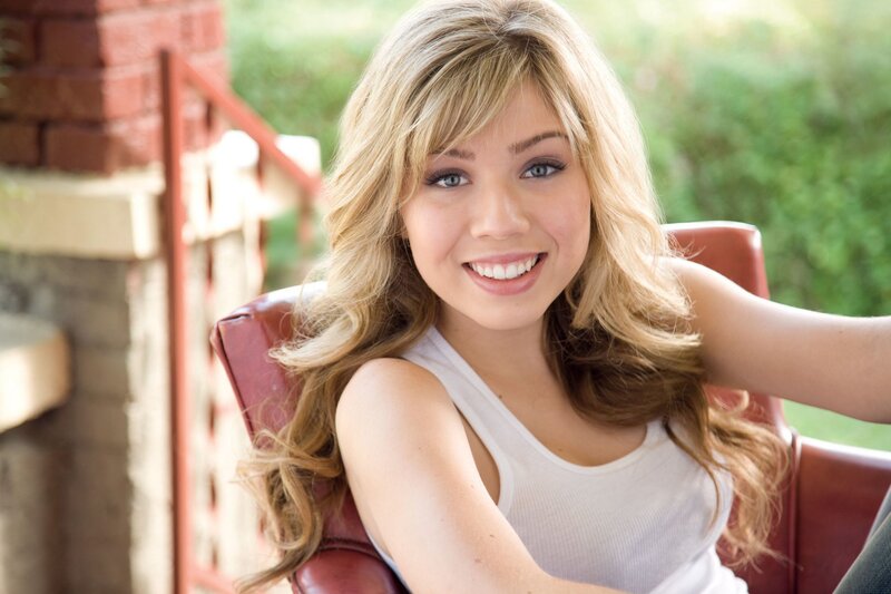 woman smiling in chair