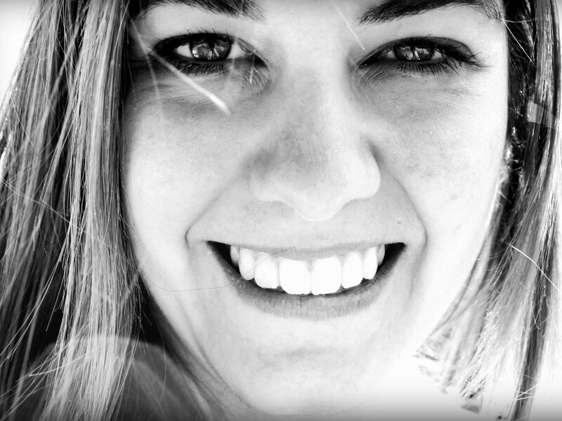 Woman Smiling in Close-up — Black