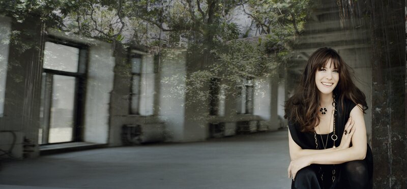 woman smiling in courtyard
