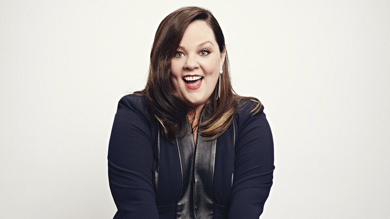 woman smiling in dark jacket