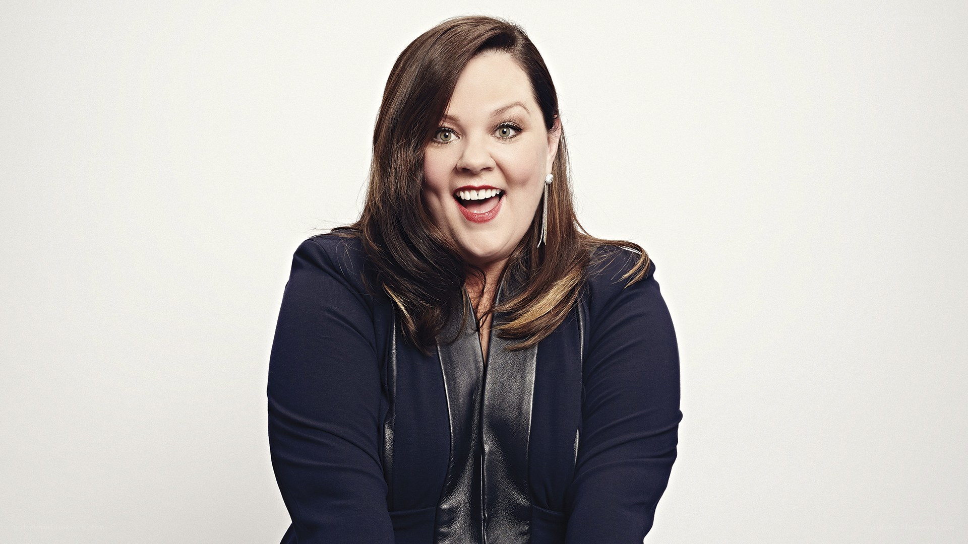 woman smiling in dark jacket