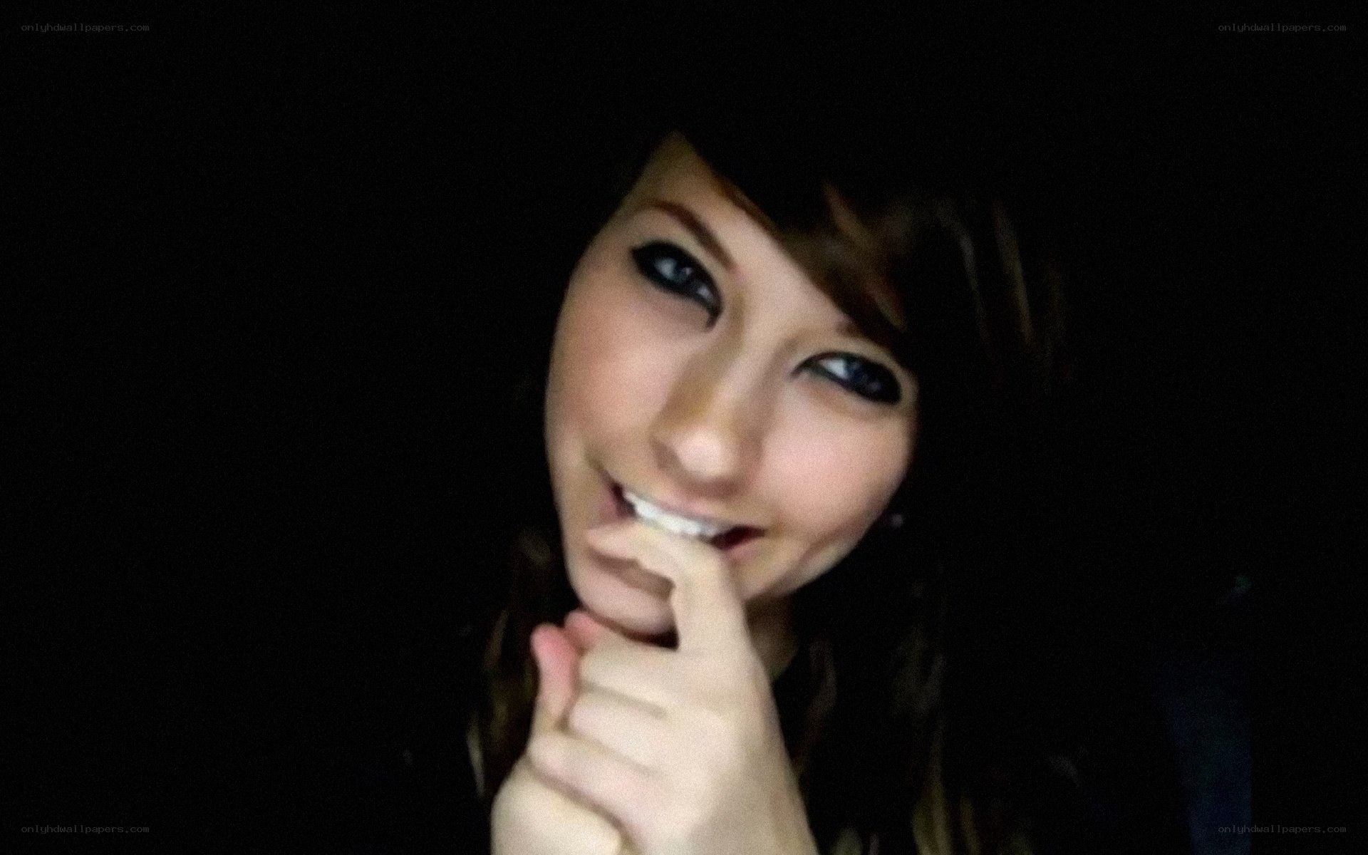 woman smiling in dark