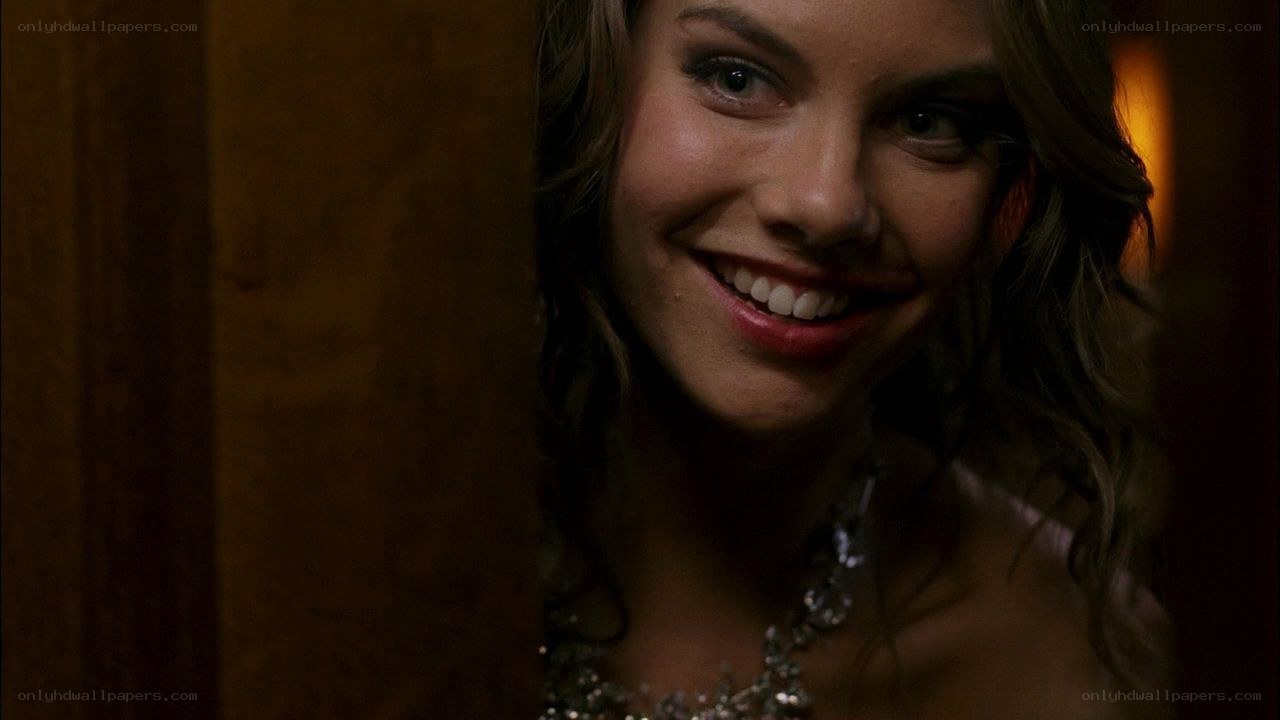 woman smiling in dim light