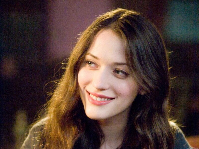woman smiling in dim light
