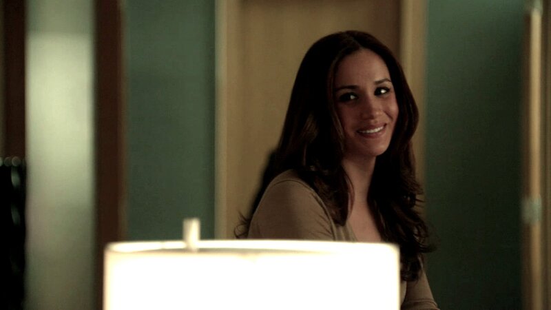 woman smiling in dim room