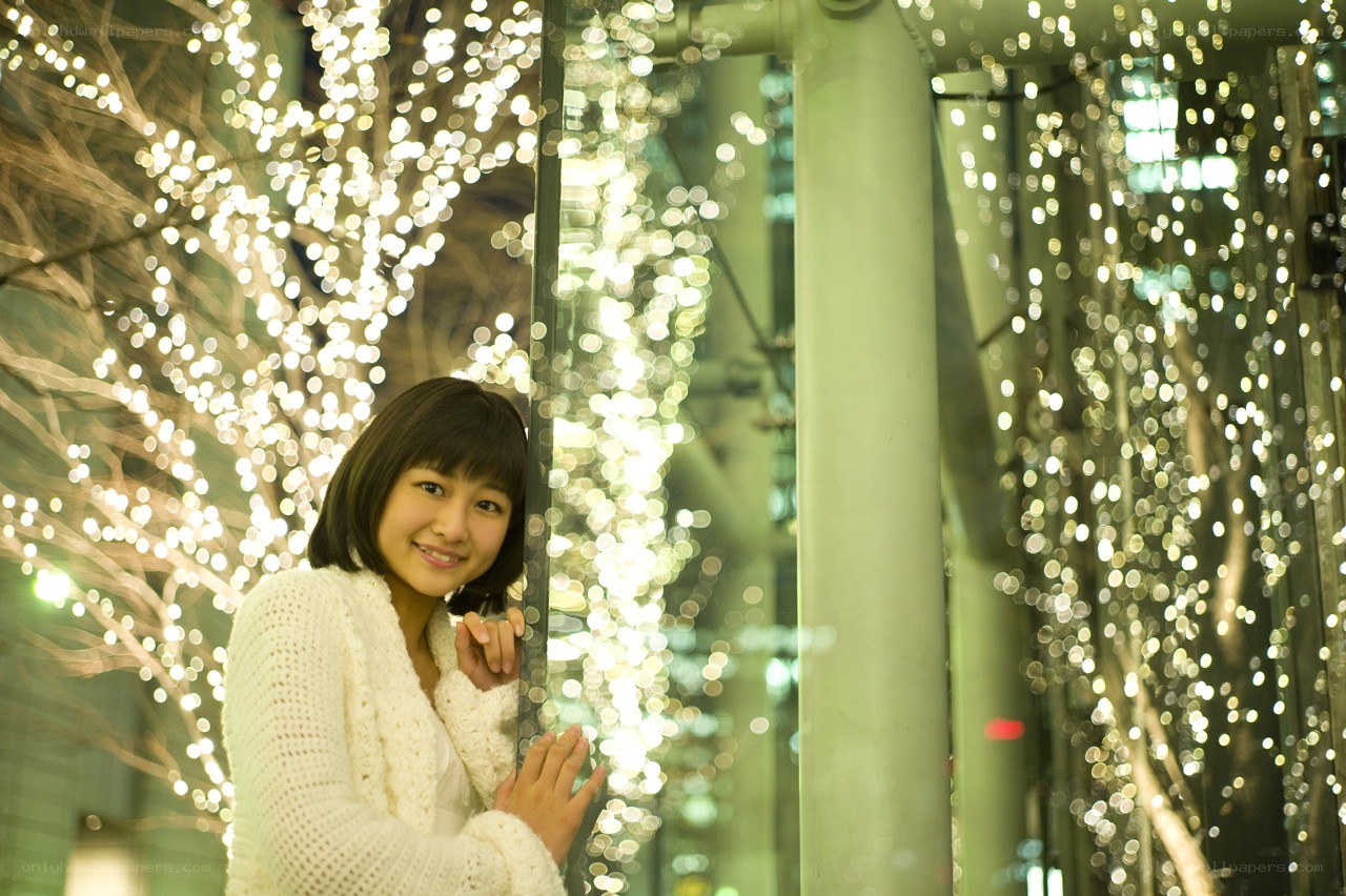 Woman smiling in festive lights