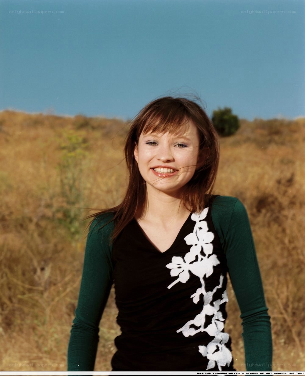 woman smiling in field