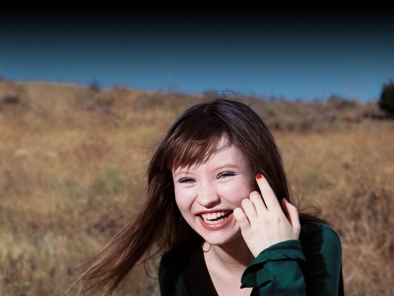 Woman Smiling in Field — Green