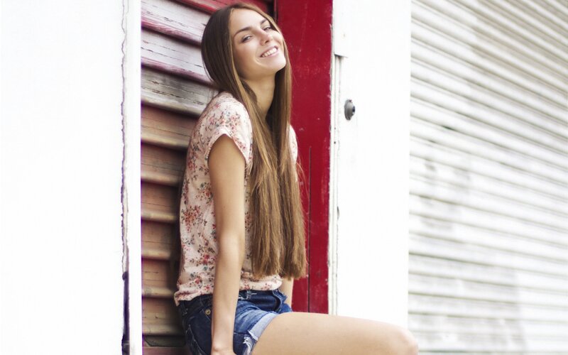 woman smiling in floral top