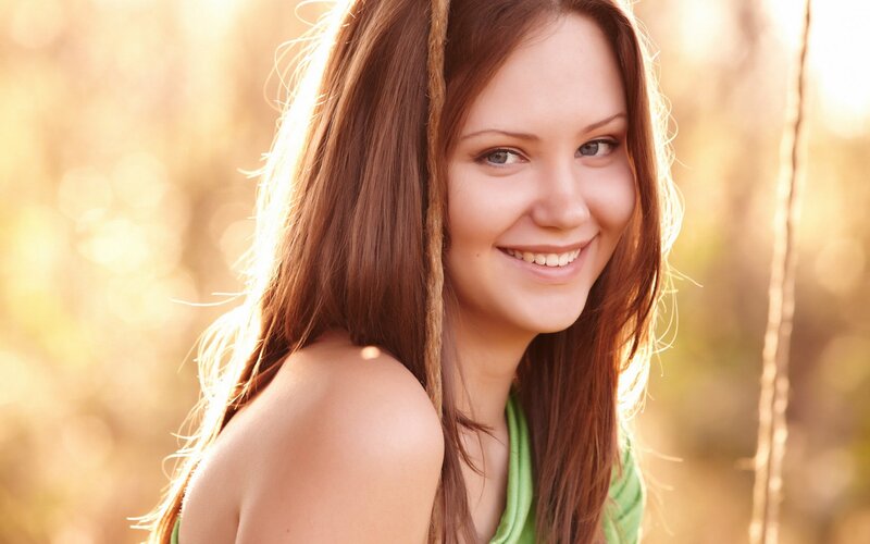 woman smiling in golden light