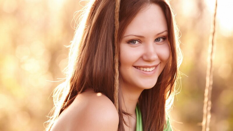 woman smiling in golden light