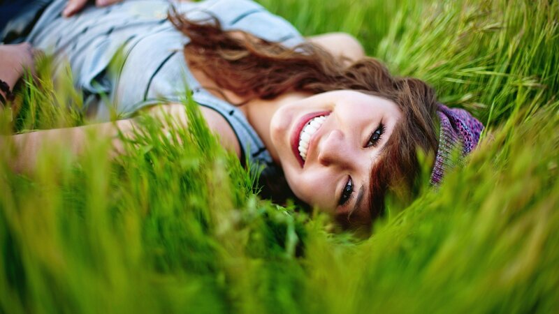 woman smiling in grass
