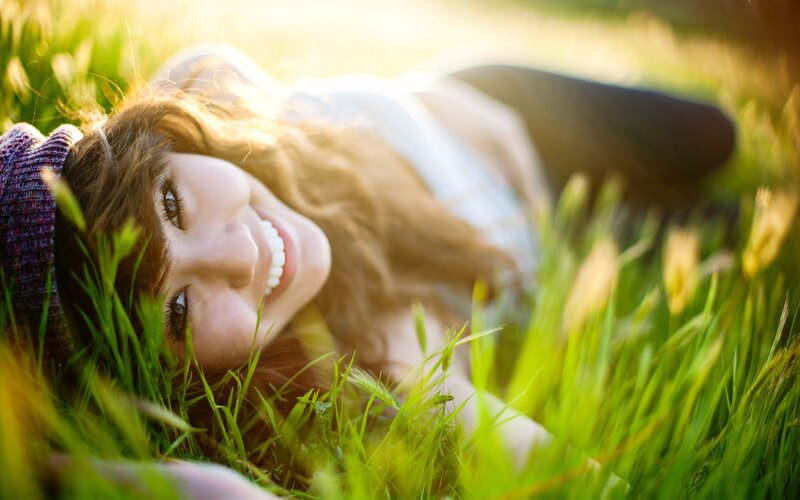 woman smiling in grass