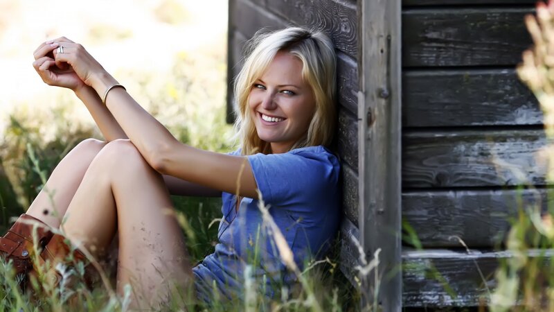 woman smiling in grass