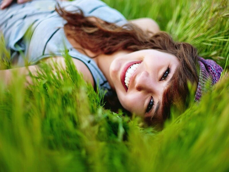 woman smiling in grass