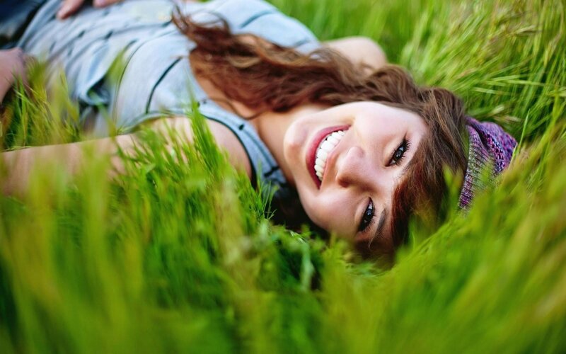 woman smiling in grass