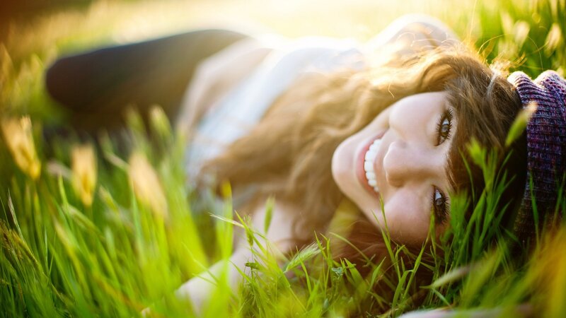 woman smiling in grass