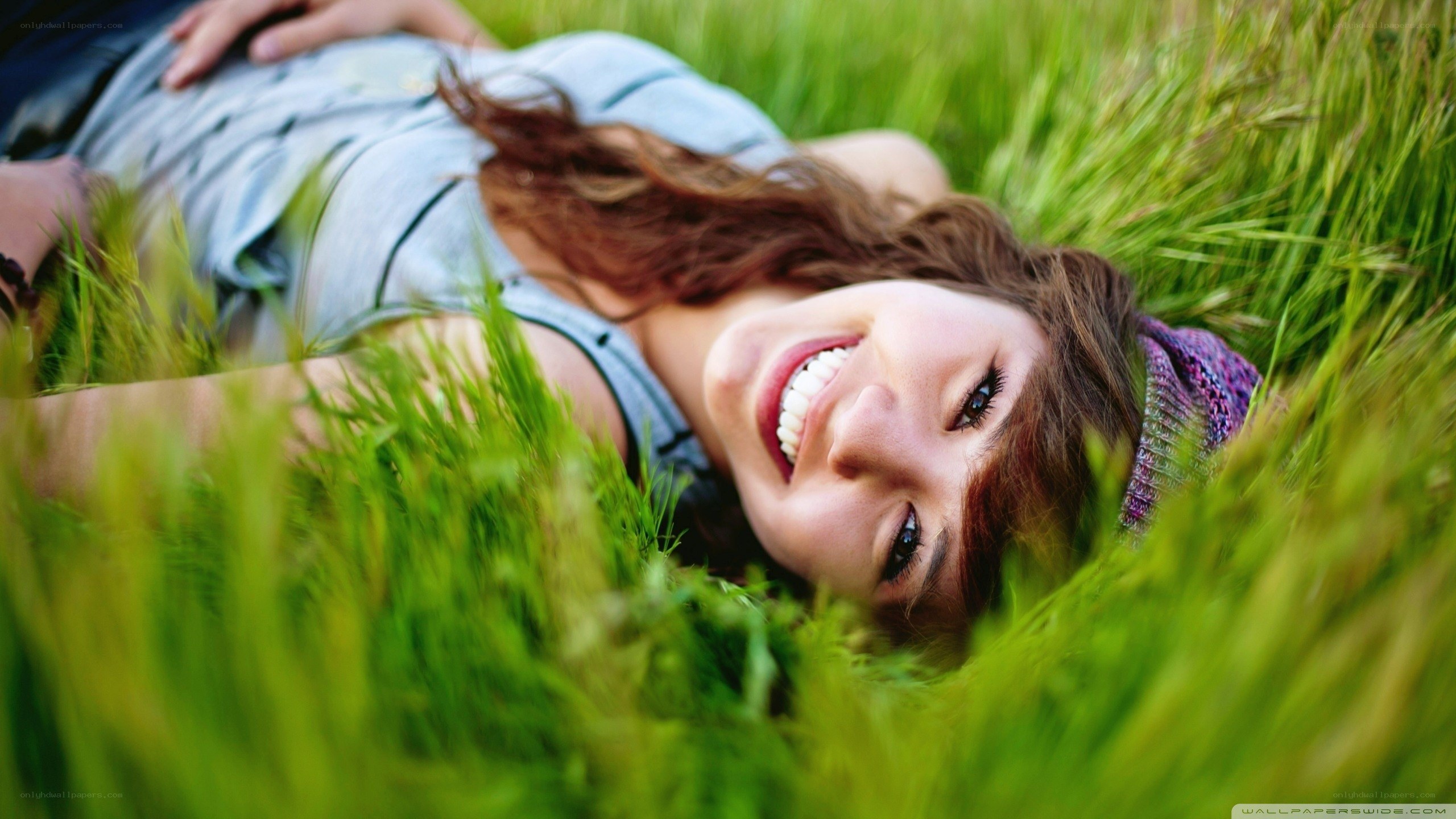 woman smiling in grass