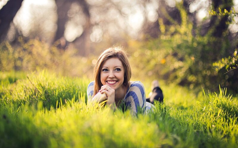 woman smiling in grass