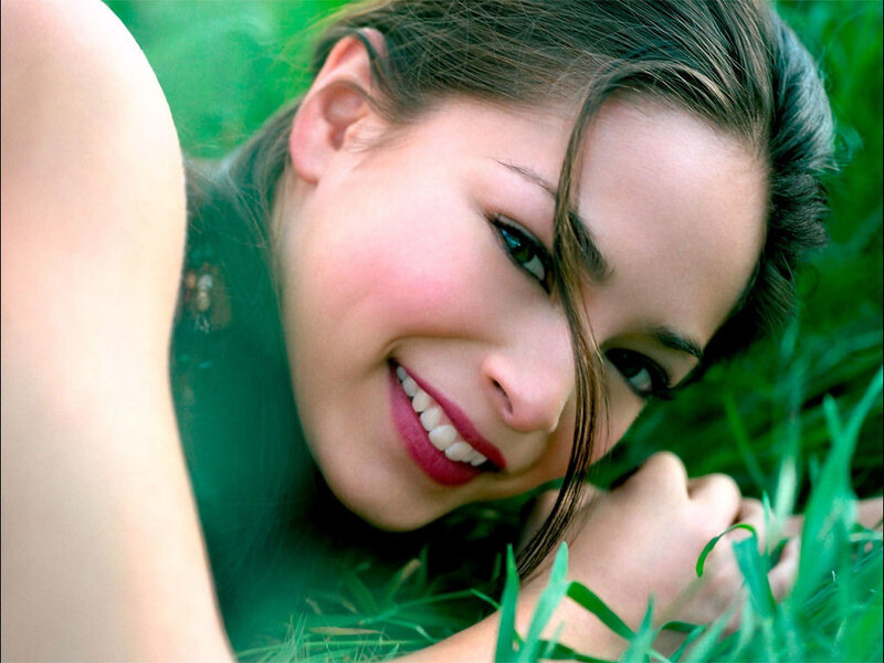 woman smiling in grass