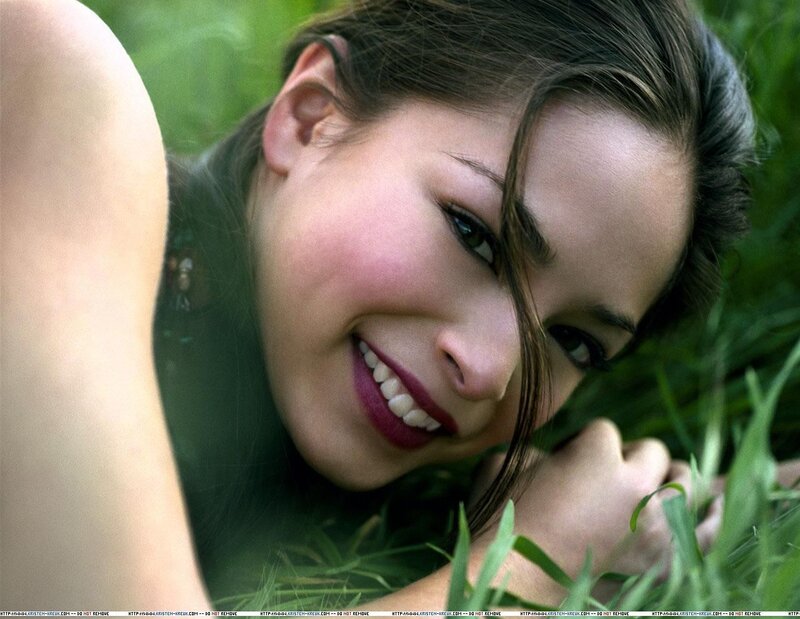 woman smiling in grass
