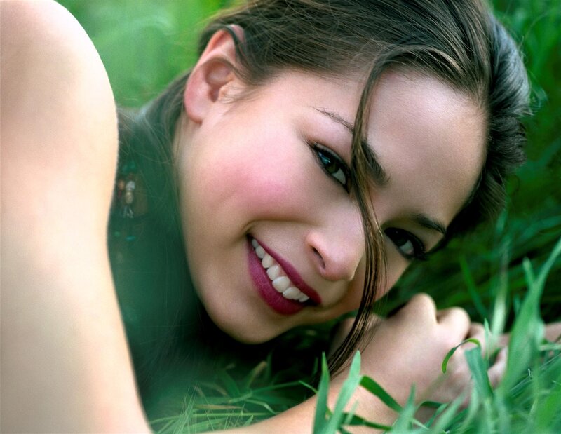 woman smiling in grass