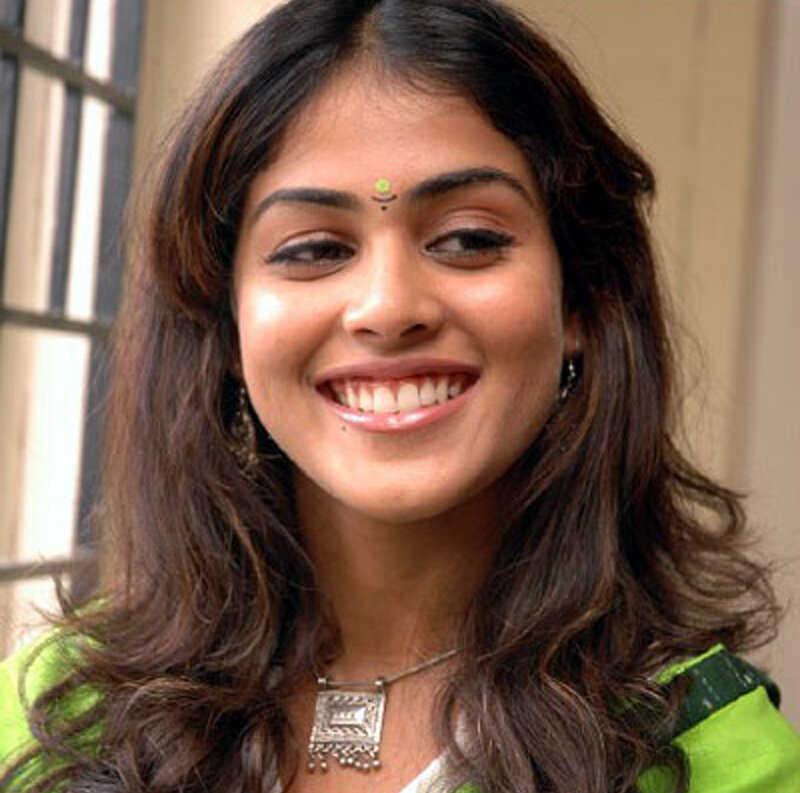 woman smiling in green outfit