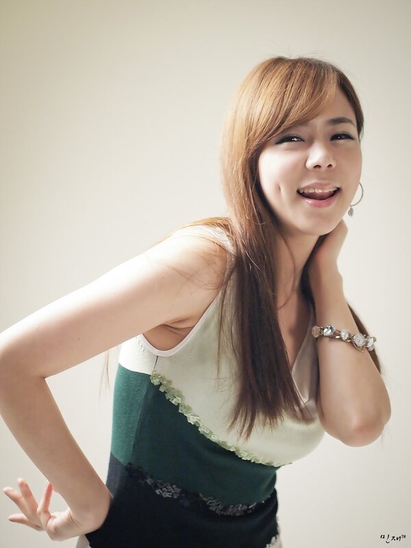 woman smiling in green top